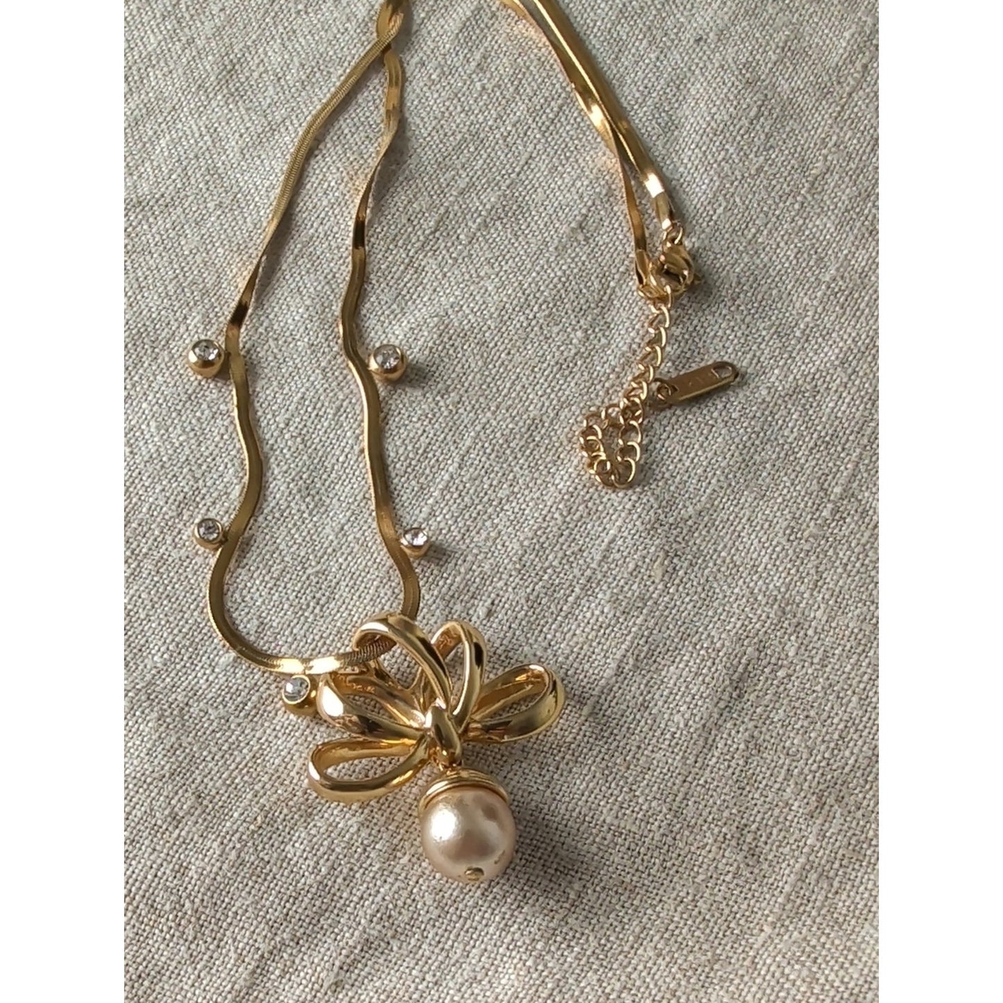 Vintage 1990s Nolan Miller Gold Tone Bow Necklace Faux Pearl Drop CZ Snake Chain