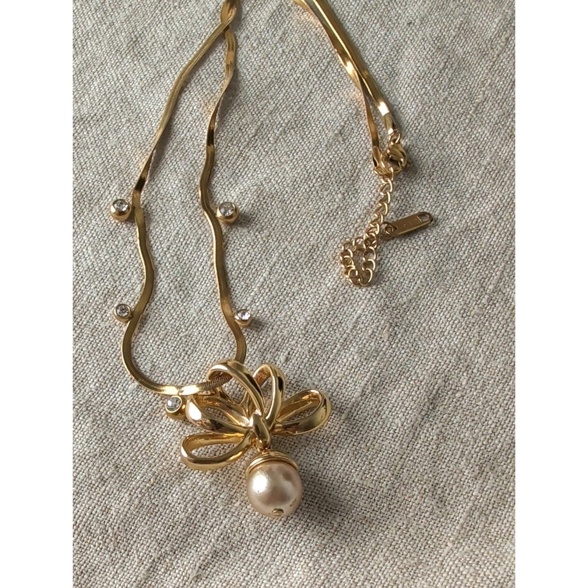 Vintage 1990s Nolan Miller Gold Tone Bow Necklace Faux Pearl Drop CZ Snake Chain
