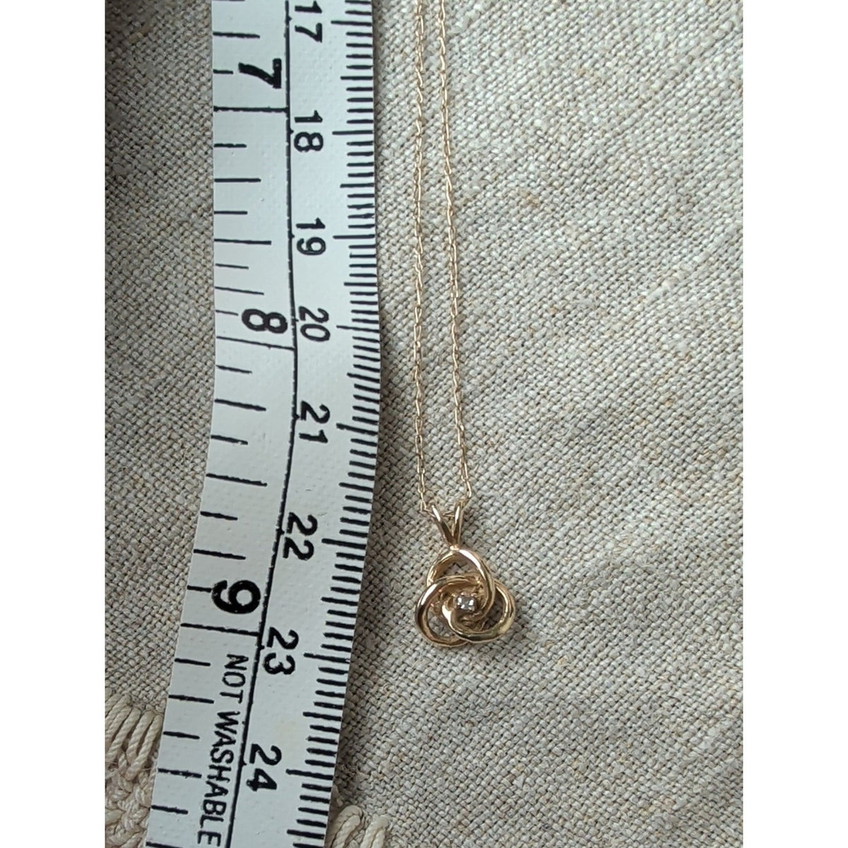 Vintage Small 14k Yellow Gold .02ct Diamond Interlocking Knot Solitaire Pendant