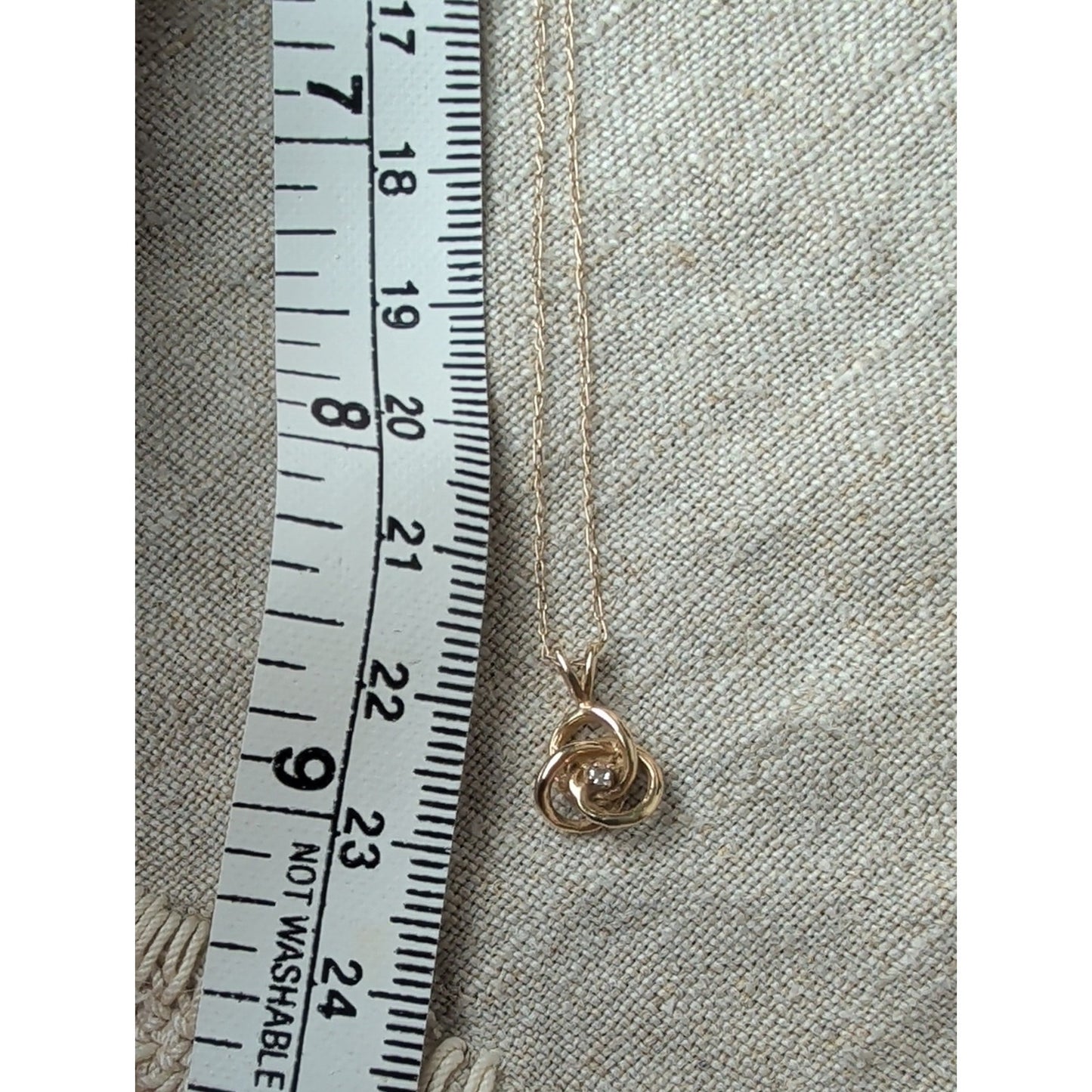 Vintage Small 14k Yellow Gold .02ct Diamond Interlocking Knot Solitaire Pendant