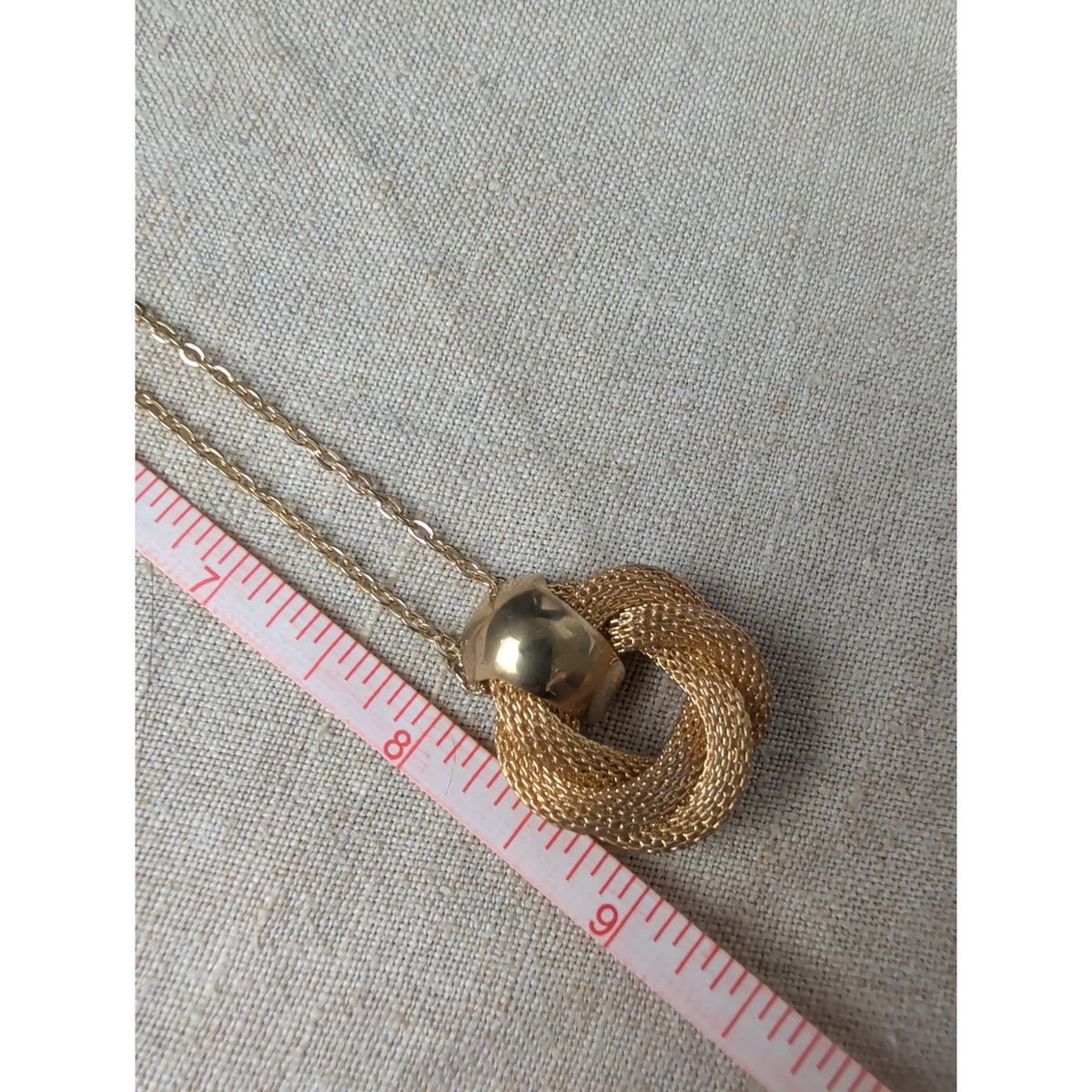 Elegant Gold-Tone Twisted Knot Pendant Necklace